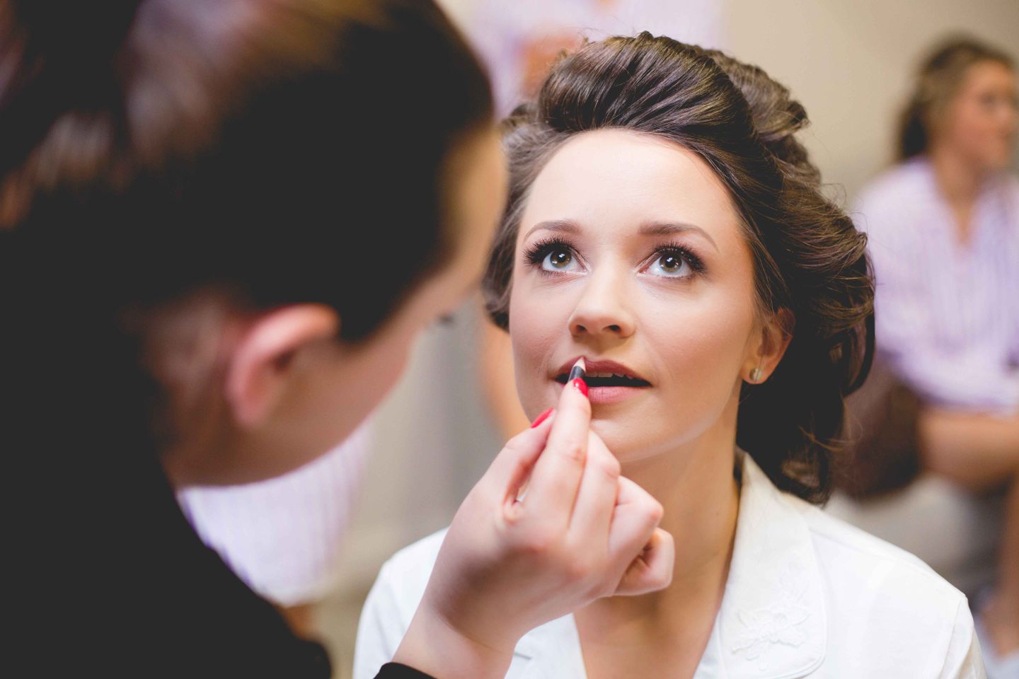 Lauren Elle Makeup Artist applying lipliner for bride on wedding day 